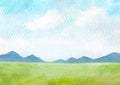 watercolor landscape with mountains, green grass field, blue sky clouds, hand drawn watercolor abstract background Royalty Free Stock Photo