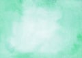 Watercolor mint color and white background texture with space for text. Light emerald gradient backdrop