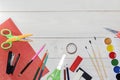 Watercolor and oil paints, brushes for painting, pencils, pastel crayon on white table. Top view. Flat lay. Royalty Free Stock Photo