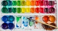 Watercolor paint palette featuring an array of bright colors arranged systematically. Royalty Free Stock Photo