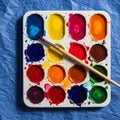 Watercolor paint set features a palette with 16 vibrant colors Royalty Free Stock Photo