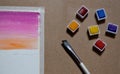 watercolor painting set with brush and colors swatches (taped down image illustration) cardboard artistic