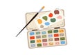 Watercolor paints box and drawing brush Royalty Free Stock Photo