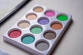 Watercolor palette on a white table in close up concept Royalty Free Stock Photo