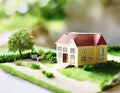 Watercolor of Real Estate Deal in Progress Miniature House Model and Contract Negotiations