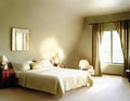 Watercolor of A roomy bedroom decorated in tones of beige and Royalty Free Stock Photo