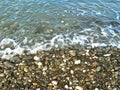 Watercolor sea landscape. Background of pebbles. Wet multicolored stones, beach with sea waves. Sea coastline. Digital painting. Royalty Free Stock Photo