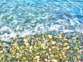 Watercolor sea landscape. Background of pebbles. Wet multicolored stones, beach with sea waves. Sea coastline. Digital painting.