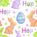 Watercolor seamless hand drawn pattern with orange purple Easter bunnies rabbits blue Easter eggs on pastel polka dot Royalty Free Stock Photo