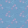 Watercolor seamless pattern with blue and pink leaf twigs, small leaves on a blue background.