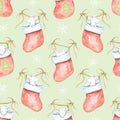 Watercolor seamless pattern with Christmas mice in red socks Royalty Free Stock Photo