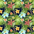 Watercolor seamless pattern with exotic plants, flowers and leaves on dark blue background. Summer tropical print. Green palm leaf