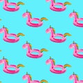 Watercolor seamless pattern of inflatable circles in the form of a pink unicorn on a blue background. Pattern for fabric and