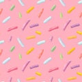 Watercolor seamless pattern with many decorative sprinkles isolated on pink background