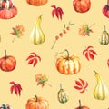 Watercolor seamless pattern with pumpkins and autumn leaves.