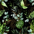 Watercolor seamless pattern with tropical leaves on a dark background. green and gold leaves on a black background. rainforest Royalty Free Stock Photo