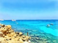 Watercolor seascape. Rocky coastline. Yachts and boats at sea Royalty Free Stock Photo