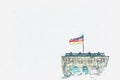 German flag over the Reichstag building in Berlin.