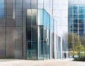 Watercolor of a sleek metal mailbox in front of a modern glass building