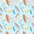 Watercolor spring seamless pattern with eggs, willow tree branches, assorted colorful feathers on blue background.