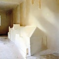 Watercolor of stack of gypsum boards in a home renovation site