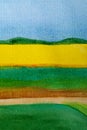 Watercolor sunny landscape with yellow sunflowers field on the horizon with blue sky and green grass meadows in front. Vertical