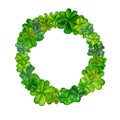 Watercolor wreath with green trefoil and quatrefoil shamrocks. Design of a bright illustration of jewelry for St