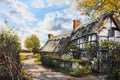 Watercolour oil painting of an old fashioned quintessential English country village in a rural landscape setting Royalty Free Stock Photo