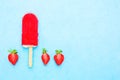 Watercolour of strawberry popsicle on blue background