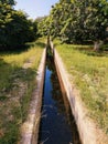 Watercourse lined-watercourse irrigation irrigation-course open irrigation-channel cours deau corriente agua curso-agua photo Royalty Free Stock Photo