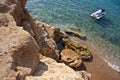 Watercraft near the rocky seashore