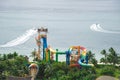 Watercraft sport and beach view tropical themed water park colorful family aquapark long rides slides surrounding by lush green