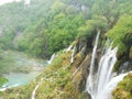Waterfal, lake cascades, canyon and wooden bridge in Plitvice Lakes National Park