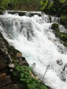 Waterfal, lake cascades, canyon and wooden bridge in Plitvice Lakes National Park