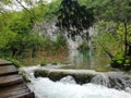 Waterfal, lake cascades and wooden bridge in Plitvice Lakes National Park, one of the oldest and largest national parks in Croatia