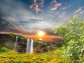 Waterfal mountain  and   tree on  field  at countryside , sea sunset wild flowers on field  water sunlight reflection nature lands Royalty Free Stock Photo