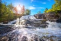 Waterfall against the blue sky Royalty Free Stock Photo
