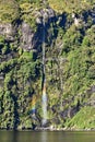 Waterfall along the fiord cliffs at Doubtful Sound, Fiordland National Park, New Zealand