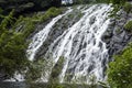 Waterfall along rugged rock