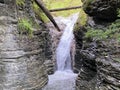 A waterfall on an alpine stream in the area ChÃÂ¤swaldtobel and and under the forest ChÃÂ¤swald, Oberiberg - Switzerland Royalty Free Stock Photo