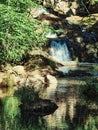 Waterfall amidst the stones in a river of crystalline waters Royalty Free Stock Photo