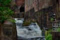 Waterfall through ancient industry buildings