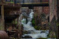 Waterfall through ancient industry buildings