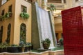 The waterfall atrium surrounded by lush green trees and plants at The Venetian Resort and Hotel in Las Vegas Nevada Royalty Free Stock Photo