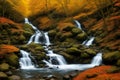 Waterfall in the autumn beech forest in the mountains