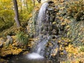 Waterfall in the autumn park Royalty Free Stock Photo
