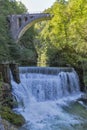 Waterfall beneath stone train bridge in the Vintgar gorge, Slovenia.