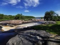 Waterfall Blue sky clouds streaming water Royalty Free Stock Photo