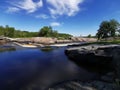 Waterfall Blue sky clouds streaming water Royalty Free Stock Photo