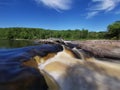 Waterfall Blue sky clouds streaming water Royalty Free Stock Photo